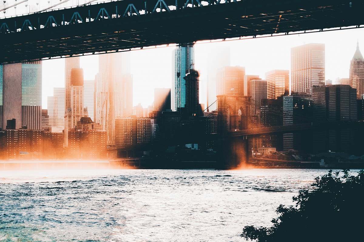 bridge photography of high-rise buildings near body of water dumbo